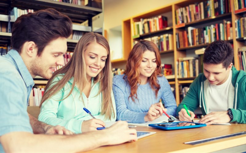 Students completing homework with instructor support